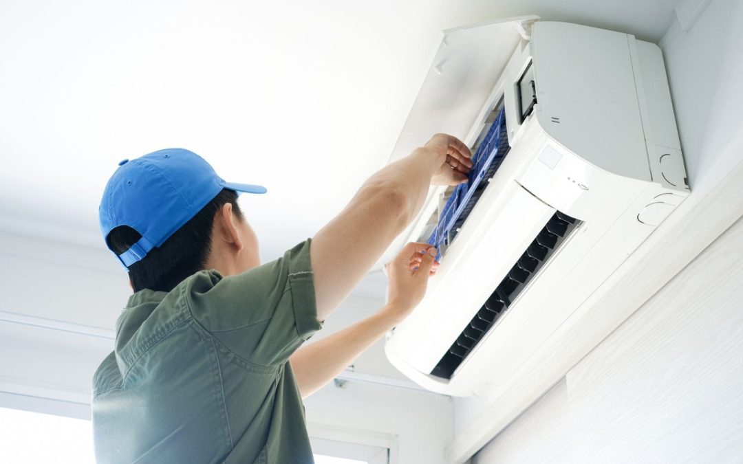 HVAC technician servicing a ductless mini split in Glendora