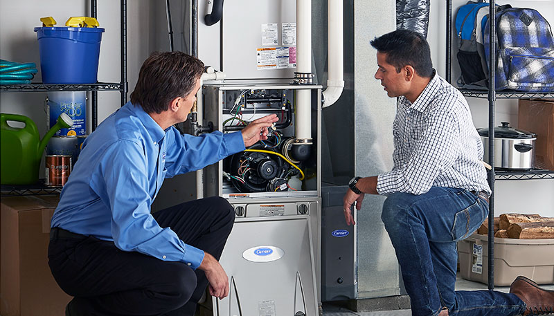 Technician evaluating a furnace for repair or replacement in Glendora