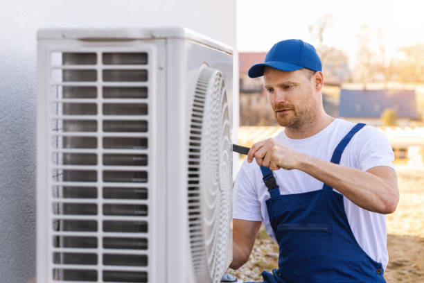 HVAC technician servicing an outdoor air conditioner in Glendora