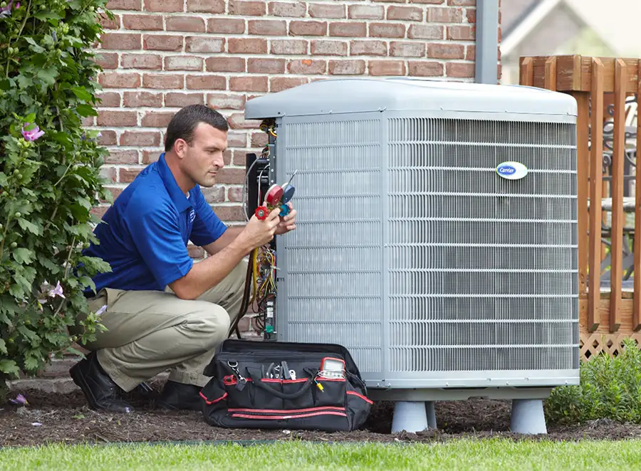 HVAC technician inspecting an outdoor AC unit in Glendora