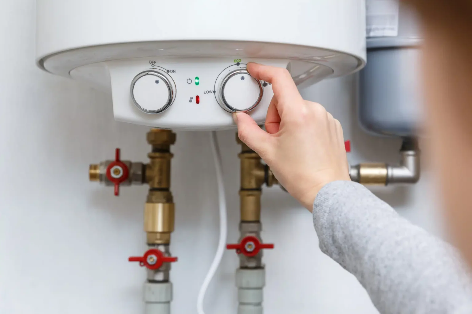 Technician adjusting a water heater in Glendora